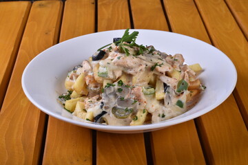 A top-down view of a bowl of chicken shawarma fries. Loaded fries on the table