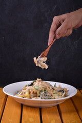 A top-down view of a bowl of chicken shawarma fries. Loaded fries on the table