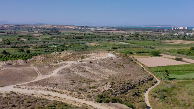 Aerial view of guardamar castle surrounded by beautiful rural landscape and expansive fields, guardamar del segura, spain.