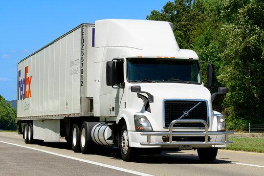 FedEx Ground Semi Eighteen Wheeler Rolls Down An Interstate Highway