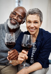 Cheers, portrait and senior couple with wine in home for date night together for marriage anniversary. Love, toast and elderly man and woman with alcohol drink to celebrate commitment in living room.