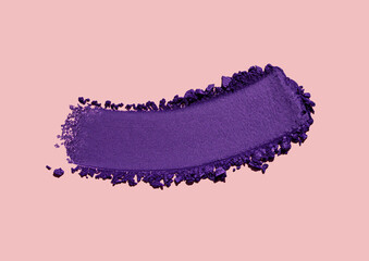 Eye shadow dark deep purple smudge light gray isolated on peach pink background 