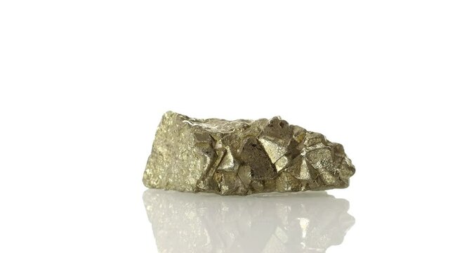 mineral stone pyrite rotates in a circle on a white background