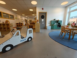 Stylish and comfortable European kindergarten for small children, classroom. Daycare playing room, playroom, game room.