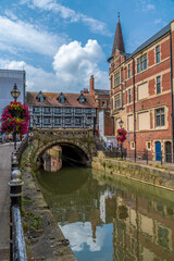 A view along the banks of the River Witham towards the High Bridge in the center of Lincoln, Lincolnshire in summertime