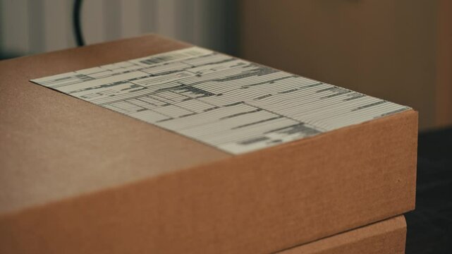 Warehouse Environment, Scanning Package Barcodes Enhances Efficiency and Operations, parcel delivery, post service for e-commerce online shopping market, close up of scanner on storage shop.