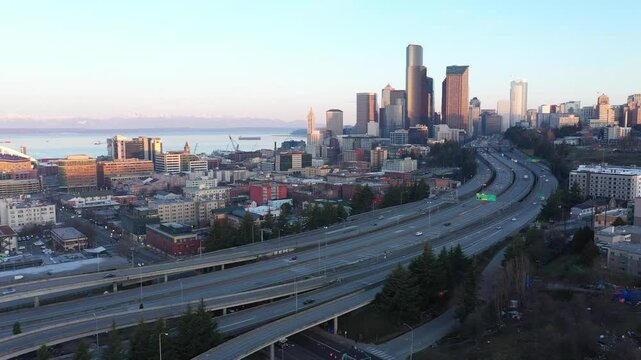 Aerial view of downtown Seattle skyline with highways, buildings, and water, Interstate 5 & 90 Interchange, Seattle, Washington, United States.