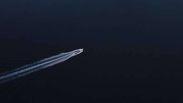 Aerial view of beautiful yachts sailing on serene blue waters with scenic coastline, Nydri, Greece.
