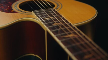 Close-up of acoustic guitar among music equipment in musical studio close-up. Strings, drums. Concert or band repetition - Powered by Adobe