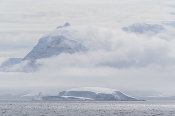Icebergs and Glaciers align the coast of the Antarctic peninsula, and its many islands. Image taken...