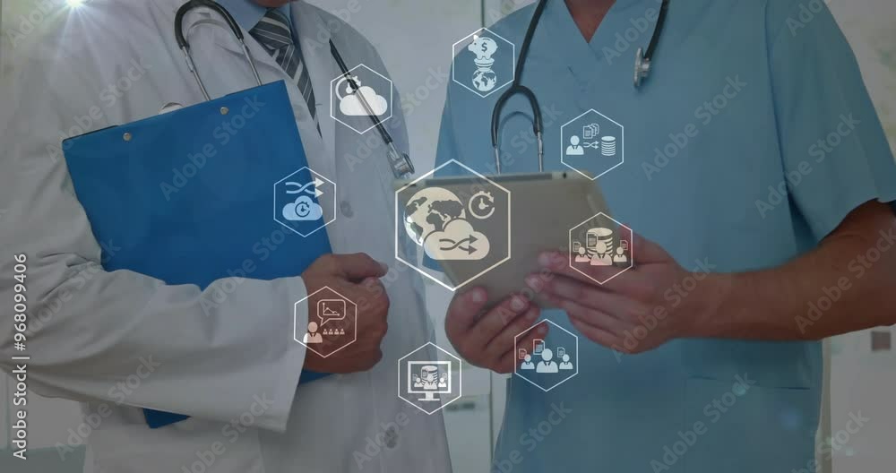 Canvas Prints Animation of business icons over caucasian male doctors using tablet