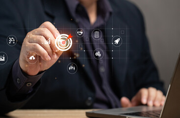 Man using pen to point at virtual screen at marketing target on map. Global business marketing plan. Marketing achievement aiming competition goal target.