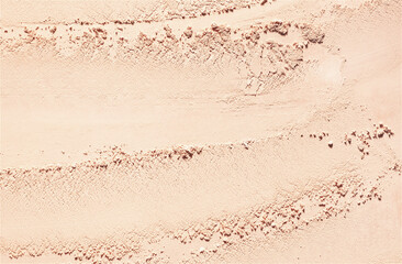 Pressed powder or beige nude eye shadow beige textured background