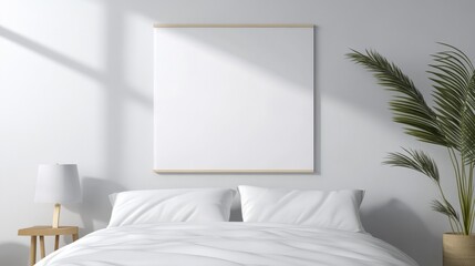 A clean and modern bedroom with a large blank canvas on the wall, perfect for displaying art or photography. The room features a white bed with crisp bedding and a touch of greenery. The minimalist de