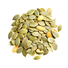 A close-up of a pile of pumpkin seeds, showcasing their natural green and yellow hues.