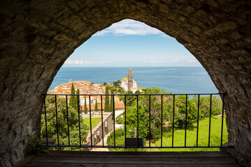 View through arch of ancient city wall over Piran, Slovenia