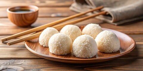 Fototapeta premium Close-up of Steamed Rice Balls on Wooden Plate, Japanese Cuisine, Asian Food ,rice ball, onigiri