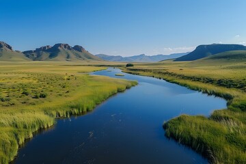 Serene River Flowing Through Lush Green Landscape Under Clear Blue Sky