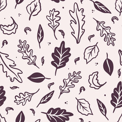 Seamless pattern of falling leaves on a beige background. Hand-drawn black line art. Cozy fall season. Autumn foliage. Vector design for textile, wallpaper, wrapping paper.