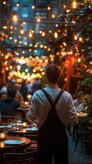 Fototapeta premium Man standing in a restaurant with a glass of wine, foreign restaurant