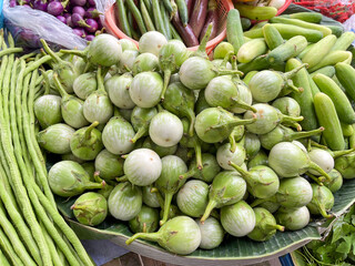 Fresh green vegetables displayed at a market, showcasing a vibrant and healthy selection for shoppers.