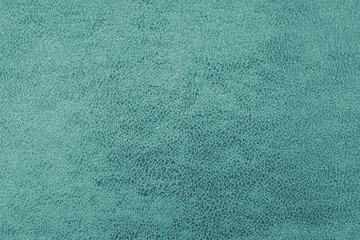 Cloth structure of jacquard turquoise fabric with abstract shabby texture background closeup, macro
