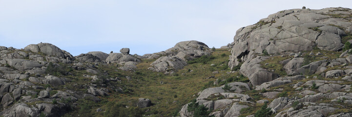 Anorthosite rock mountain and boulder near Egersund, Norway.