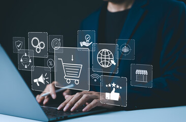 Shopping and E-commerce technology concept. A person using laptop with digital icons representing online shopping, global connectivity, marketing, customer reviews, and modern ecommerce technologies.