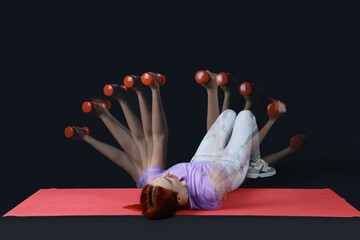 Young fitness trainer with dumbbells in motion on dark background
