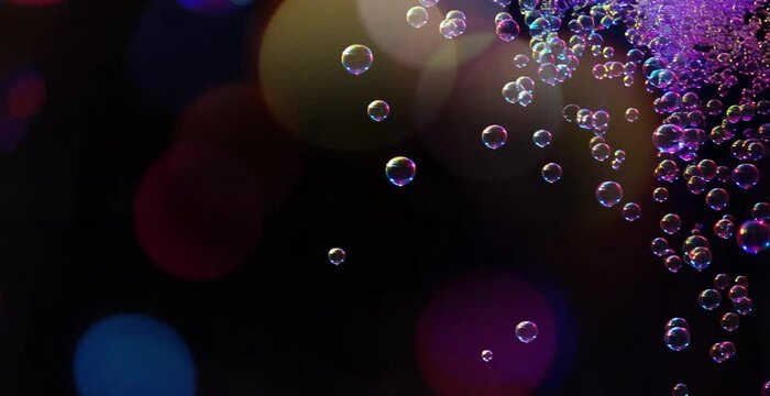 soap halographic bubbles on black, slowly float in space, soap bubbles bokeh background, copy space