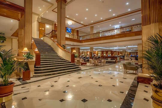 Spacious and elegantly decorated hotel lobby, offering a luxurious guest experience.