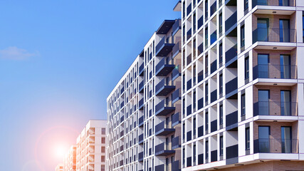 Fototapeta premium Modern architecture of urban residential apartment building. Apartment building exterior, residential house facade.