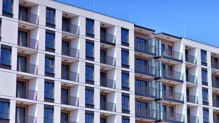 Fototapeta premium Modern architecture of urban residential apartment building. Apartment building exterior, residential house facade.