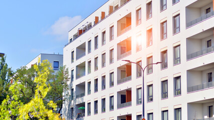 European residential architecture harmonizing with nature. Eco-friendly living in city with greens. Eco apartment building saving energy and fresh air concept. 