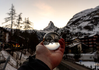 Creative view of the Matterhorn through a crystal ball in Zermatt, Switzerland