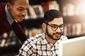 Students, tutor and teamwork in library on computer for higher education, knowledge or college...