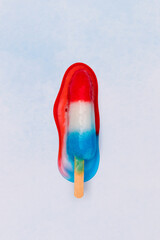 Melting red white and blue popsicle