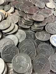 A big pile of shinny US quarters.