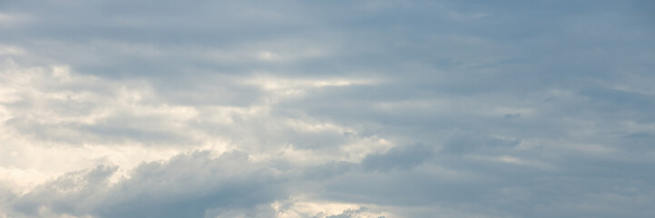 Beautiful sky background with clouds. Scenic cloudscape. Wide panoramic background for design.