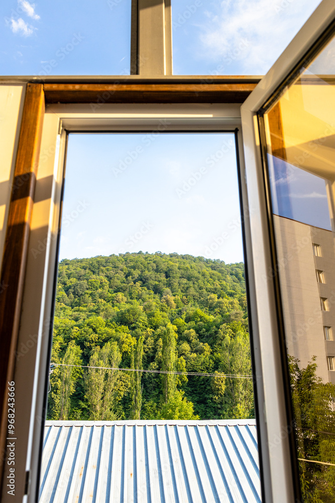 Wall mural view of mountain through open window in dilijan
