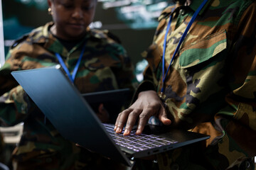 Military troopers communicating gps coordinates used in tracking hostile vessels to national guard,...