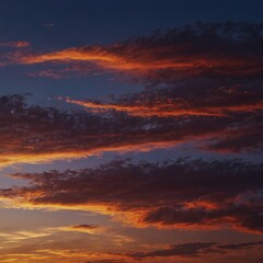 Fototapeta premium Colorful sunset sky with vibrant hues of orange, red, and blue.