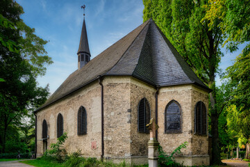 Fototapeta premium The church of St. Mary Magdalene and Lazarus in the Cologne cemetery Melaten from the year 1245
