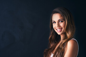 Portrait, woman and fashion with confidence, hair care or positivity on black background. Female person, style and trendy in mockup space as satisfied or casual in outfit, clothes and pride as model