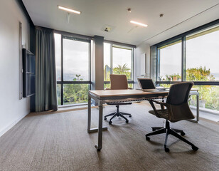 Obraz premium A clean, minimalist office space with sleek furniture, a large desk, and a laptop open, surr