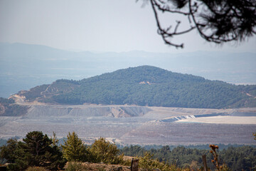 Landscape of an open pit mine with lots of sand and rocks. Landscape view of an open pit mine for the extraction of iron ore