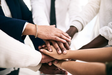 Obraz premium Team building, hands and business people in circle for support, mission or motivation for goal in office. Group, closeup or together in huddle for community, connection or partnership for cooperation