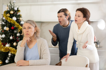 On Christmas Eve adult children man and woman clashed over financial question with elderly woman...