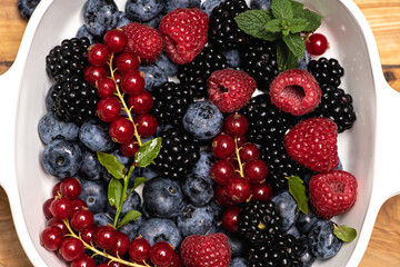 Mix of different berry berries. Berries fruits background. Antioxidants, detox diet, organic...