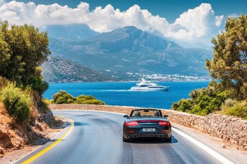 Convertible car on crete s coastal road with yacht and scenic blue sky background